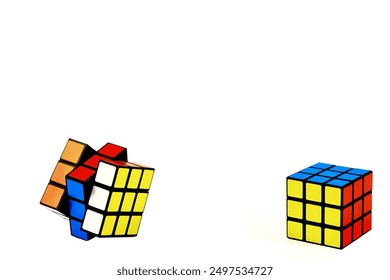 A Rubik's cube. puzzle. a mathematical problem. On a white isolated background.colorful cubes.They rotate them and collect them with their hands.Russia.Moscow.26.12.2023