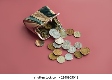 Ruble Coins Spilled Out Of Small Purse On Dark Pink Background