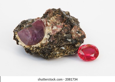 Ruby Rough And Cut Stones Is At White Background