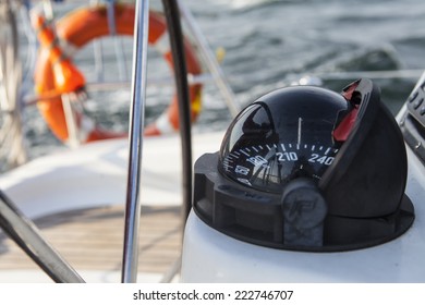Rudder And Compass On A  Boat.