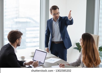 Rude Angry Boss Executive Demanding To Leave Meeting Dissatisfied Irritated By Female Colleague, Mad Annoyed Businessman Firing Businesswoman Employee As Gender Discrimination And Harassment Concept