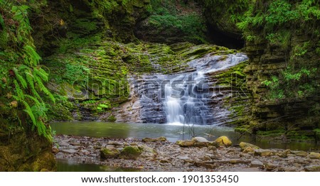 Rufabgo waterfall in of the caucasian mountains. Caucasus mountains, Adygea, Russia.