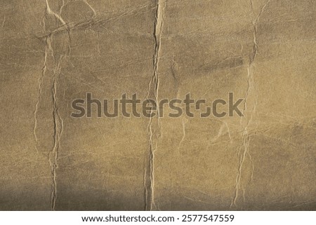 a ruffled brown paper background that looks thick and old and messy 