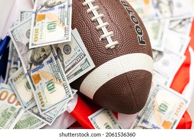 rugby ball and dollars on american flag - Powered by Shutterstock