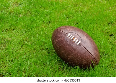 Rugby Ball On Rugby Pitch Grass With Copy Space