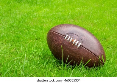 Rugby Ball On Rugby Pitch Grass With Copy Space