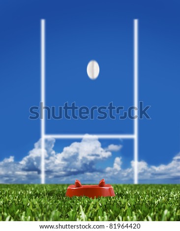 Rugby ball ready to be kicked over the goal posts