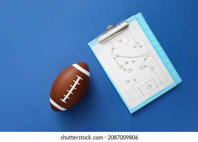 Rugby ball with scheme of football game drawn on color background