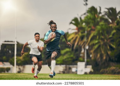 Rugby, chase and black man with ball running to score goal on field at game, match or practice workout. Sports, fitness and motion, player in action and blur on grass with energy and skill in sport. - Powered by Shutterstock