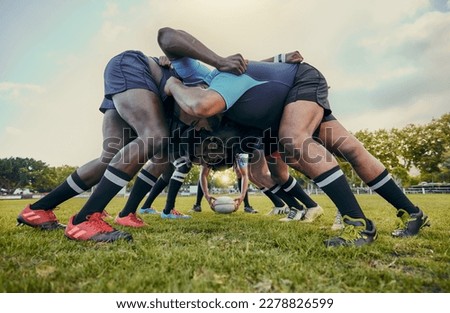 Rugby fitness, scrum or men training in stadium on grass field in match, practice or sports game. Teamwork, ball or strong athletes in tackle exercise, performance or workout in group competition
