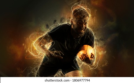 Rugby football player holds ball. Sports banner. Dark background - Powered by Shutterstock