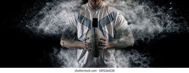 Rugby football player holds ball. Sports banner. Horizontal copy space background - Powered by Shutterstock