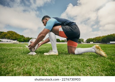 Rugby kick, sports man or ball in training game, practice workout or match on stadium field outdoors. Fitness, ready or athlete player in action playing in cardio exercise on grass in France, Paris - Powered by Shutterstock