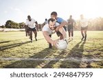 Rugby, man and diving with ball for touchdown or win score with a try, tackle and competitive sports or game. Team, athlete and field for football or running for championship tournament and match.