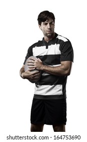 Rugby Player In A Black And White Uniform. White Background