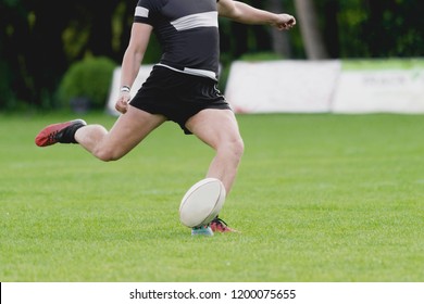 Rugby player kicking off. Team sport - Powered by Shutterstock