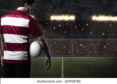 Rugby player in a red uniform on a stadium. - Powered by Shutterstock