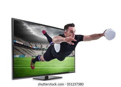 Rugby player scoring a try against rugby stadium - Powered by Shutterstock