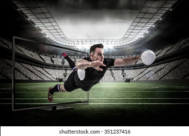 Rugby player scoring a try against rugby arena - Powered by Shutterstock