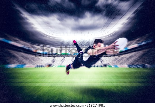 Rugby player\
scoring a try against rugby\
stadium