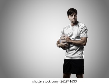 Rugby Player In A White Uniform On A White Background.