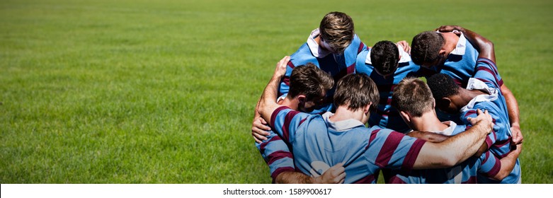 Rugby players against rugby ball on the pitch - Powered by Shutterstock