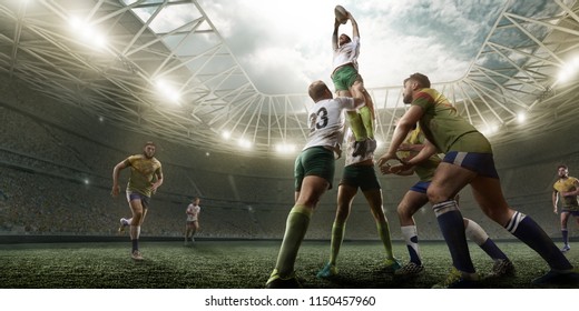 Rugby players fight for the ball on professional rugby stadium - Powered by Shutterstock