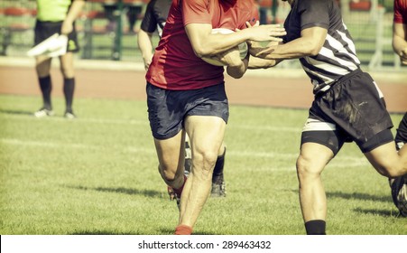 Rugby players fighting for ball - sports concept, retro style photo - Powered by Shutterstock