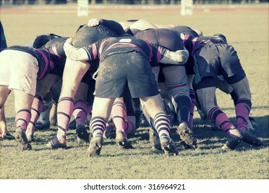 Rugby players fighting for ball - sports concept, retro style photo - Powered by Shutterstock