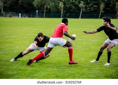 Rugby Players Playing A Match At The Park