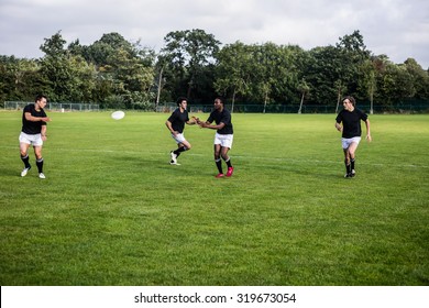 Rugby Players Training On Pitch At The Park