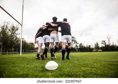 Rugby Players Training On Pitch At The Park