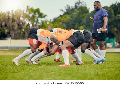 Rugby, scrum or men training with coach on grass field ready for match, practice or sports game. Fitness, performance or strong athletes in tackle for warm up, exercise and workout for a competition - Powered by Shutterstock