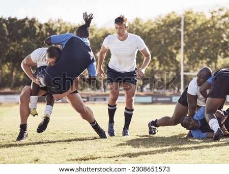 Rugby, sports and men tackle for ball on field for match, practice and game in tournament or competition. Fitness, teamwork and players playing on grass for exercise, training and performance to win