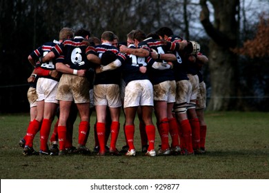 Rugby Team In A Huddle