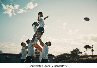 Rugby, team jump and lift for ball and teamwork, sport and training for game, fitness and exercise or sports performance with blue sky. Group, men and lifting man to catch and professional match - Powered by Shutterstock