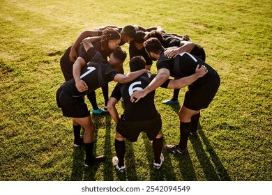 Rugby, team and talking together for huddle, motivation and game field for match preparation. Above sports, fitness and group of men outdoor with competition planning, club and practice with exercise - Powered by Shutterstock