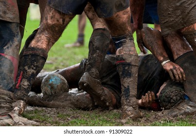 rugbymen lying down in rugby scrum - Powered by Shutterstock