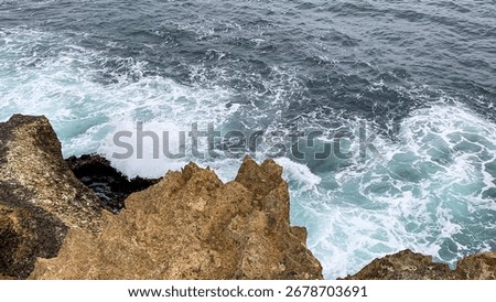 Rugged cliffs embrace tempestuous waves, evoking Ocean Day celebrations and the ancient Celtic pagan festival of Lughnasadh