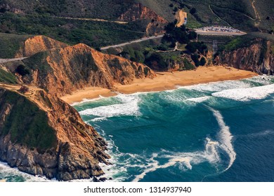 Rugged coastal cliffs by the Devil's Slide bunker and Gray Whale Beach in San Mateo County, Northern California, flying from San Francisco, USA