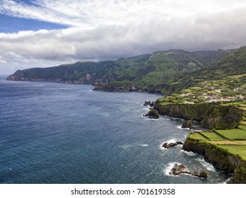 Rugged coastline near the town of Ponta Delgada on the island of Flores in the Azores.  - Shutterstock ID 701619358