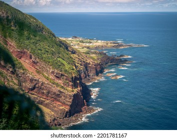 Rugged coastline of the Portuguese Azores islands in the Atlantic ocean. The islands are lined with lush rain forests and rugged volcanic rocky coastlines, - Shutterstock ID 2201781167