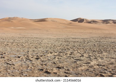 Rugged, hot and dry desert sand dunes terrain in Abu Dhabi emirate in the United Arab Emirates, where summer daytime temperatures can reach 50 Celsius (122 Farenheit) between May and September.