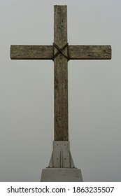 Rugged Wooden Cross Held With Rope