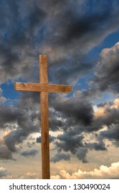 Rugged Wooden Cross Over Sunset Sky