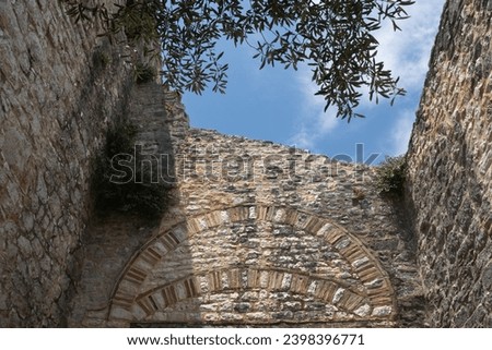 Ruin of the historical castle is considered one of the most imposing architectural remains in the Ionian Islands. Walls are made of stone. View on the cloudy sky., as there is no roof. Kassiopi, Corfu