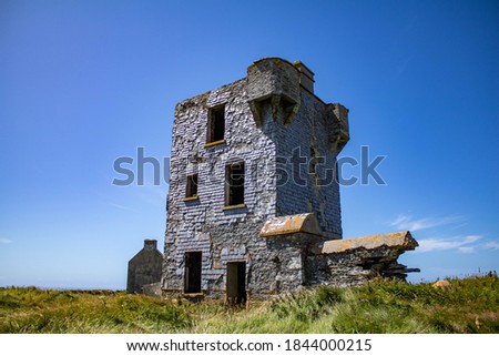 Ruin of an old signal tower and coast guard station on Brow Head, West Coast of Ireland 