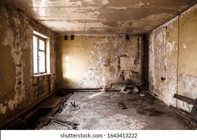Ruined apartment of deserted hotel, old room with one window and damaged cracked walls, abandoned house, horror style interior, mystical place - Shutterstock ID 1643413222