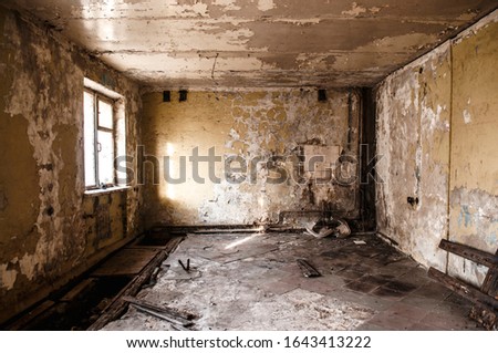 Ruined apartment of deserted hotel, old room with one window and damaged cracked walls, abandoned house, horror style interior, mystical place