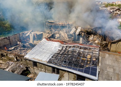 Ruined Building On Fire As Example Of Rocket Air Strike Result Between Israel And Gaza In Middle East Conflict.